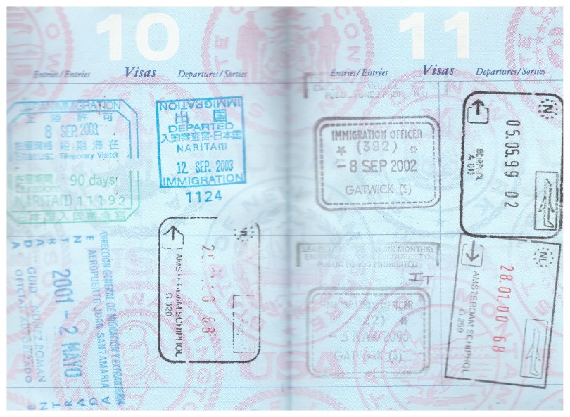 Two passport pages with stamps from Japan (in and out), Costa Rica (in), The Netherlands (one in, two out), England (two in)