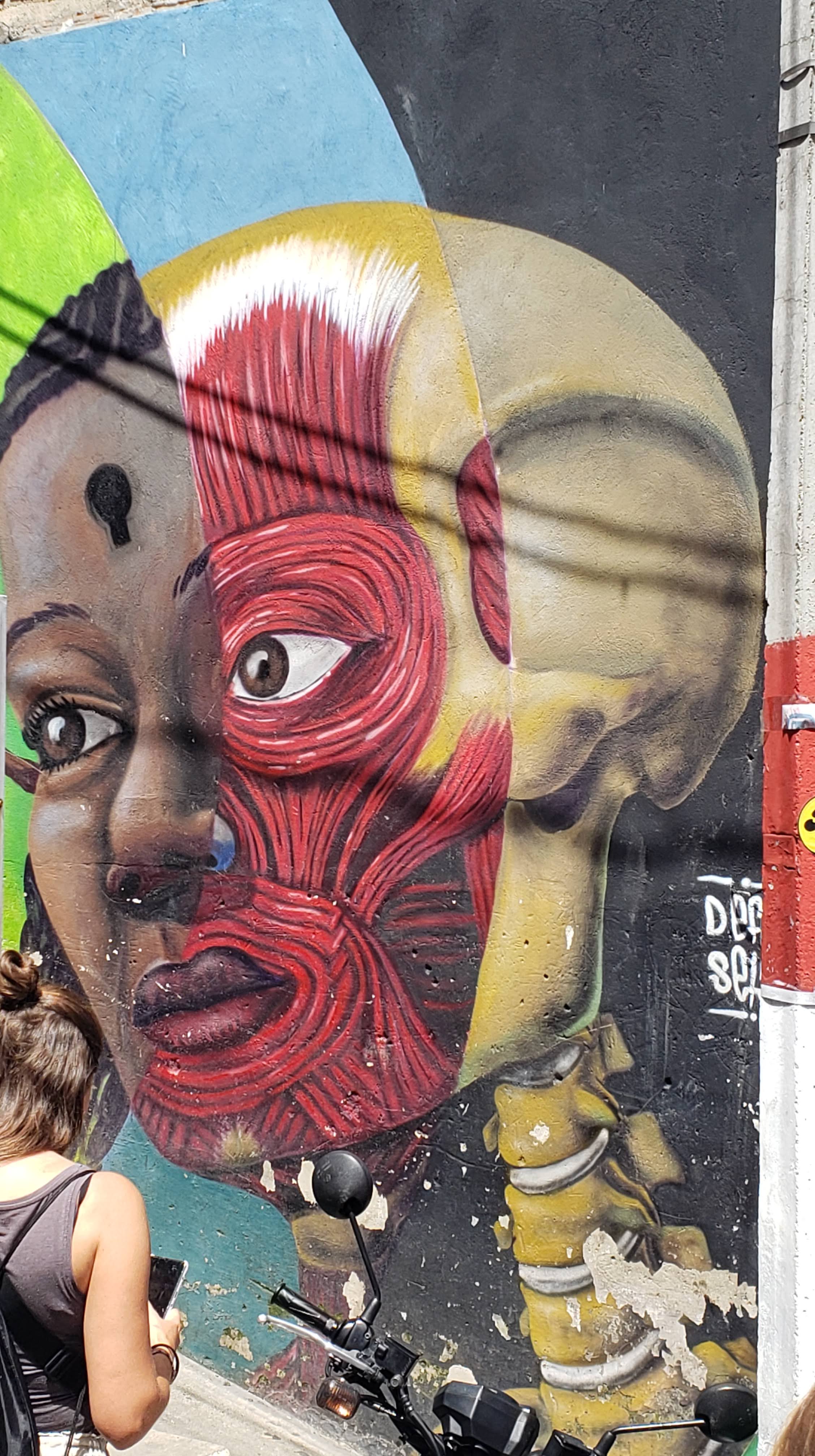 A woman's head with layers of muscle and bone shown in a medical-diagram style