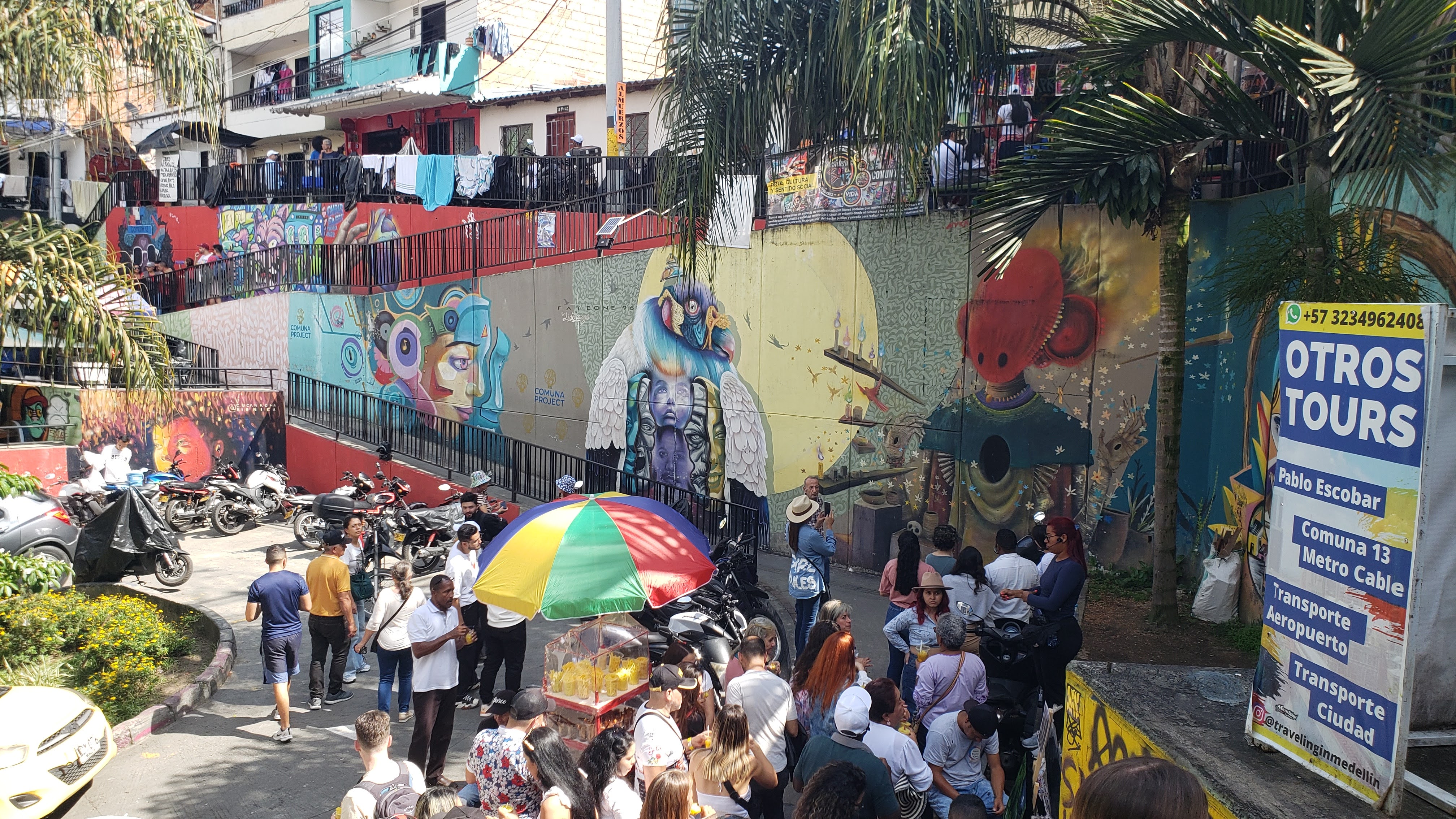 Wall with three separate murals in varying styles