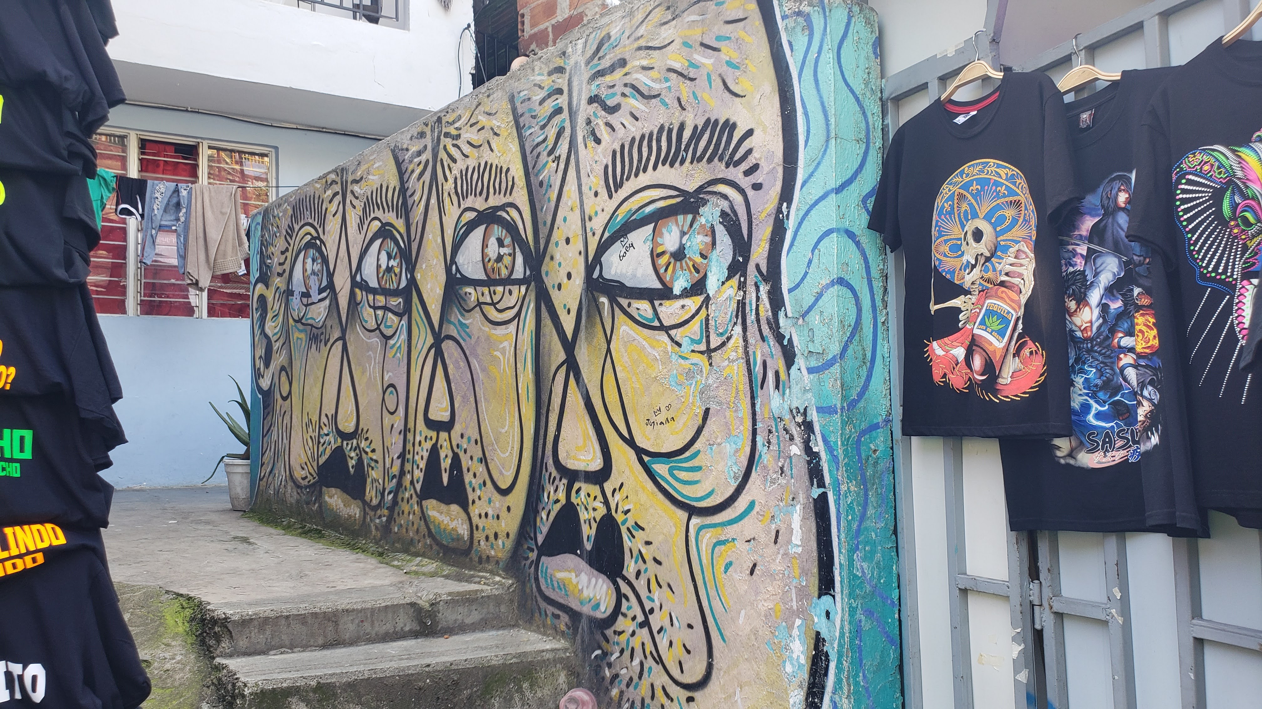 Mural showing three, stylized faces