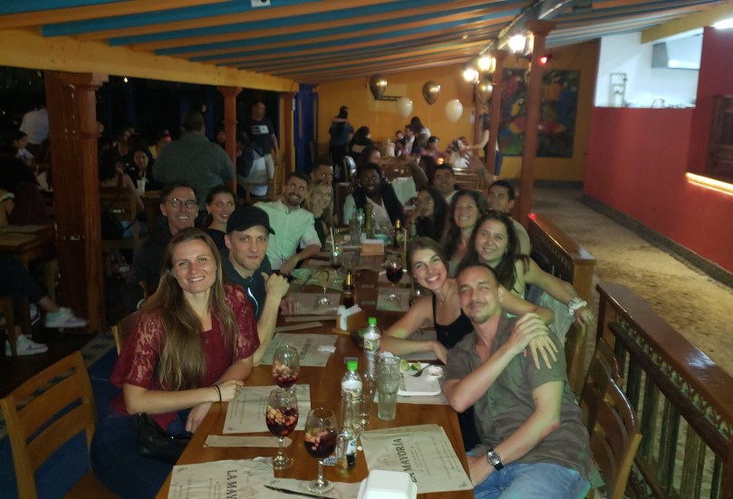 A large table of smiling faces